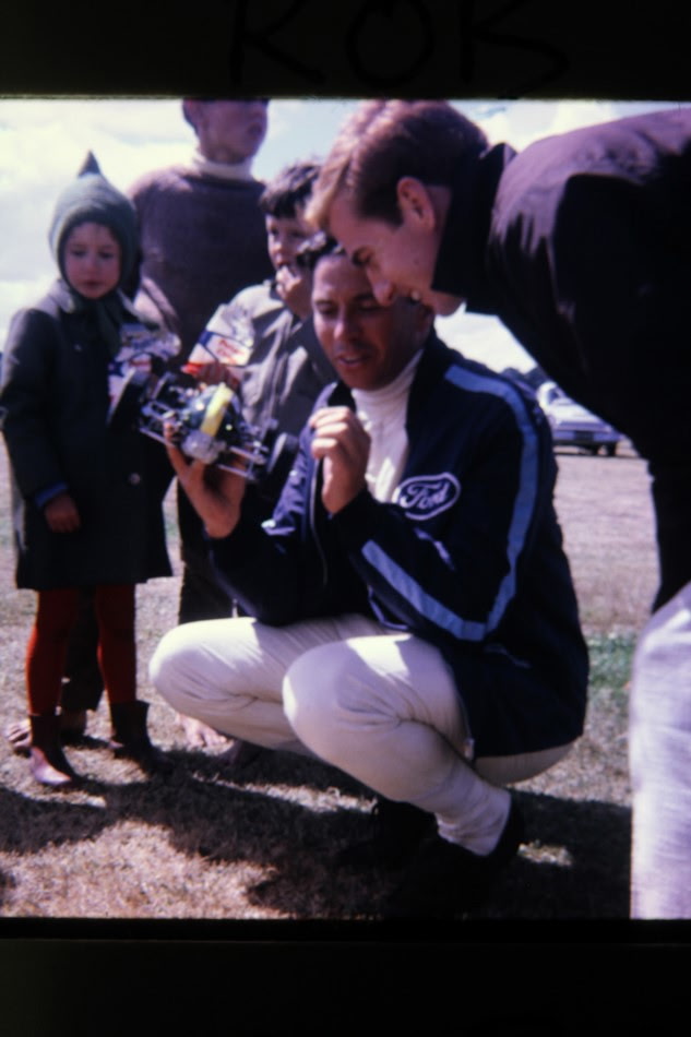 Showing the hand-built Lotus model to young fans at the track