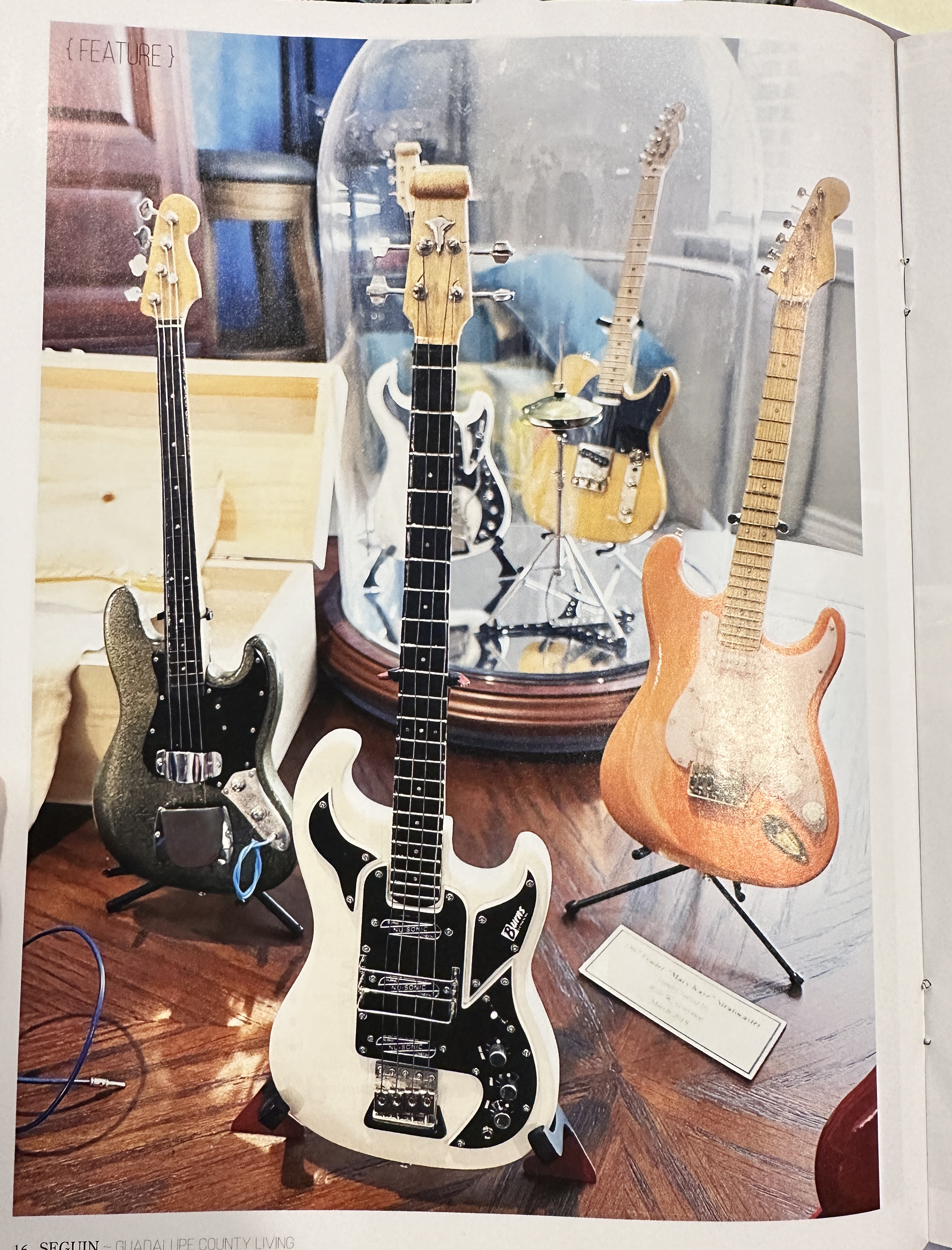Rob Gwynn miniature guitars displayed together on stands in a collector-style arrangement