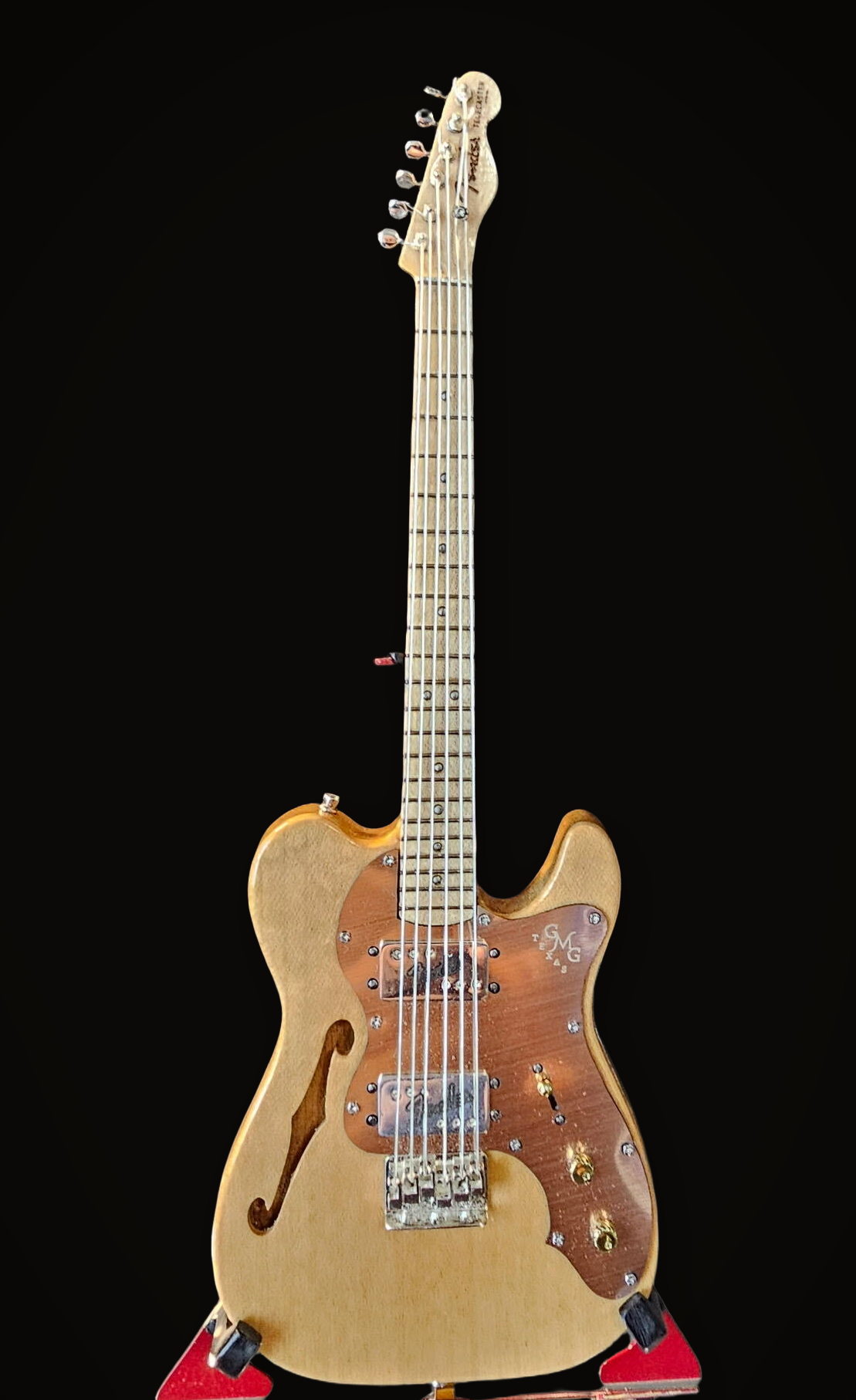 Handcrafted miniature Fender Telecaster Thinline in birds eye maple with walnut veneer, bronze pickguard, brass knobs and sterling silver hardware by Rob Gwynne