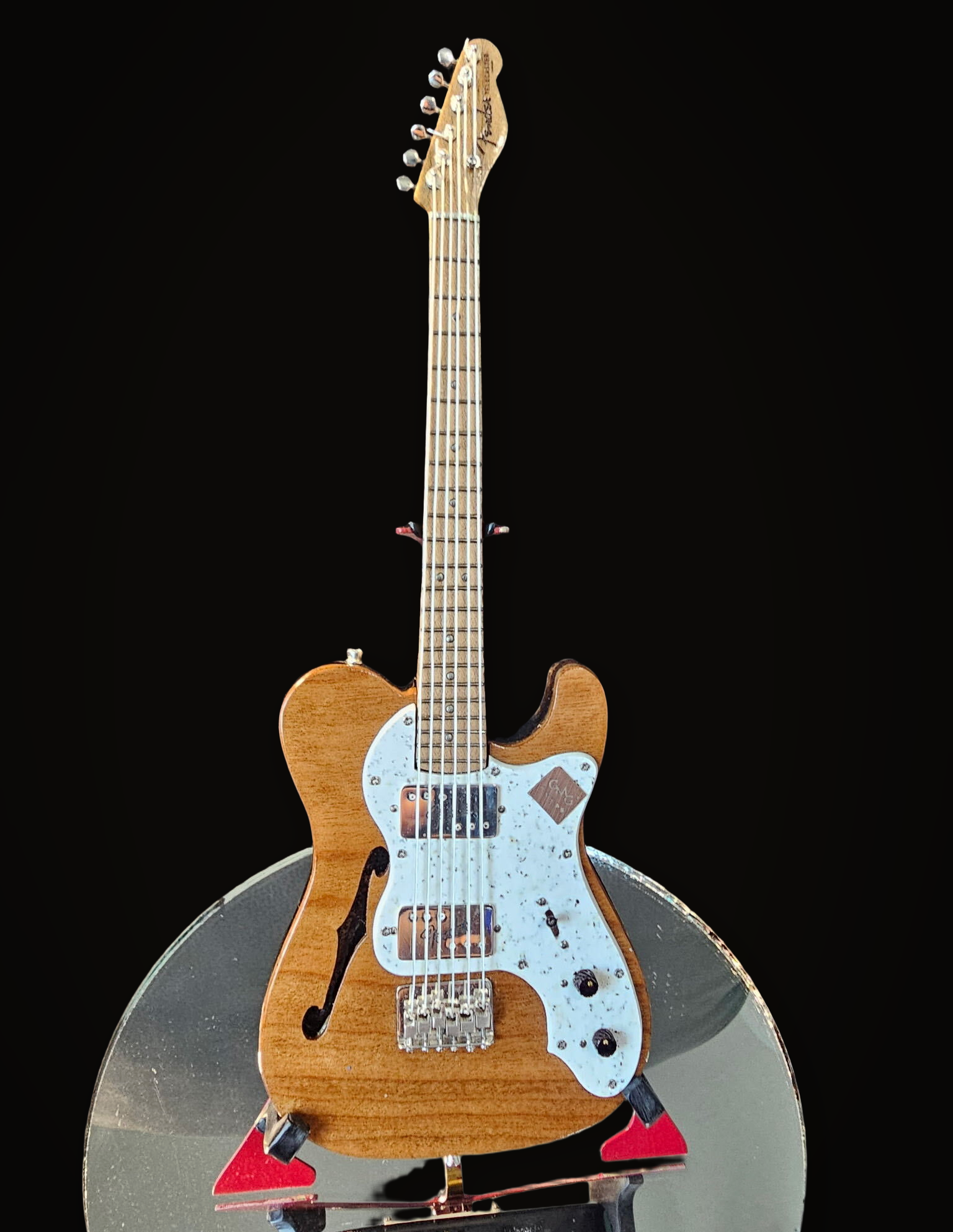 Handcrafted miniature Fender Telecaster Thinline with ebony body, Brazilian mahogany veneer, speckled plastic pickguard and sterling silver hardware by Rob Gwynne